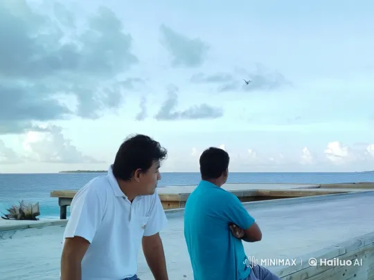 Seaside Friendship: Men Embrace in Tranquil Coastal Setting – AI Generated Video | Hailuo AI