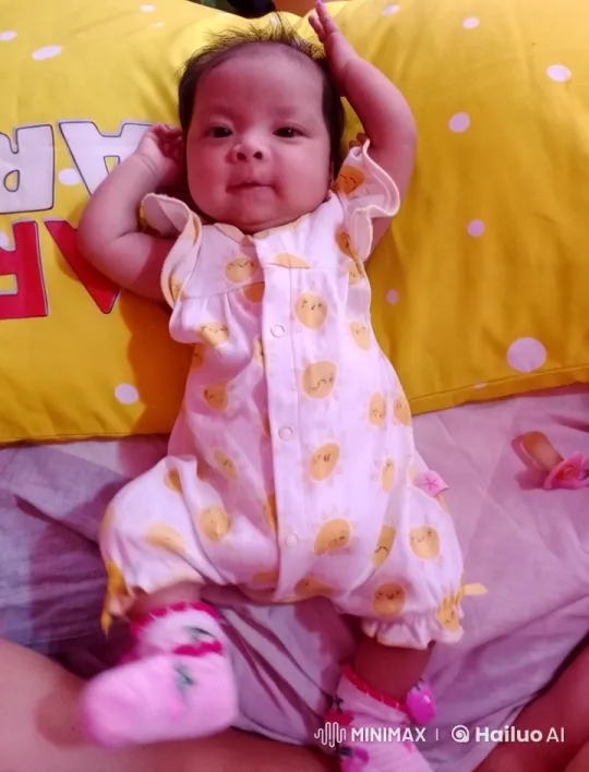 Joyful Baby Kicking Playfully on Polka Dot Pillow – AI Generated Video | Hailuo AI