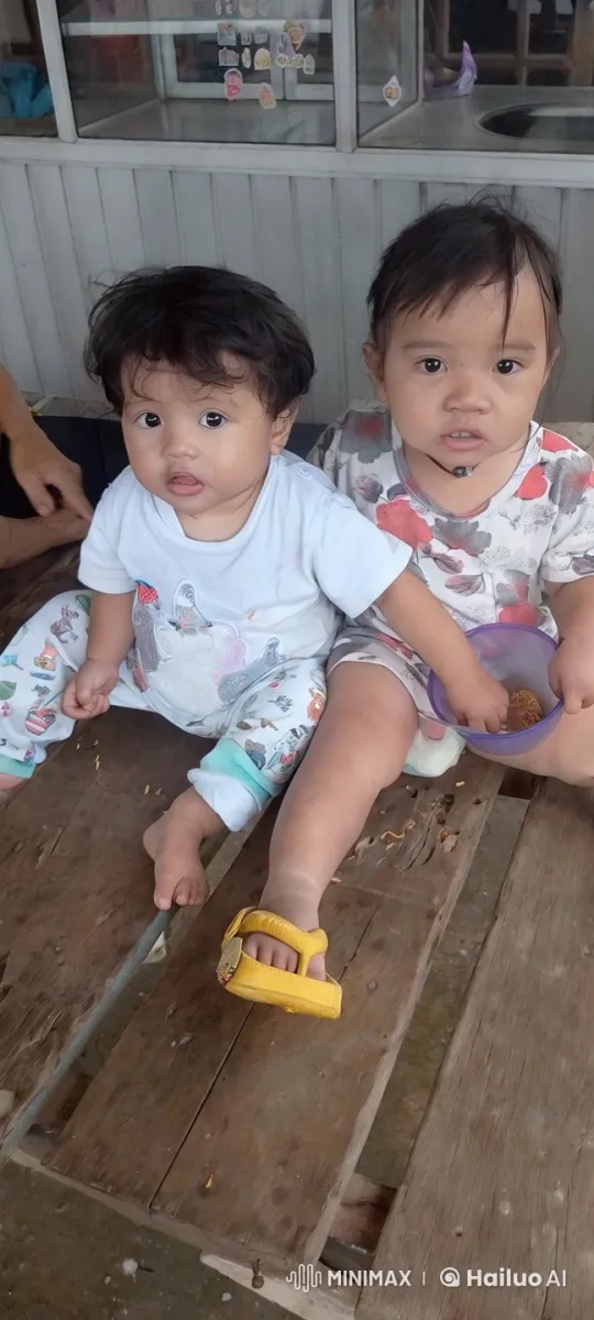 Two Children Enjoying Snacks in a Sticker-Decorated Room – AI Generated Video | Hailuo AI
