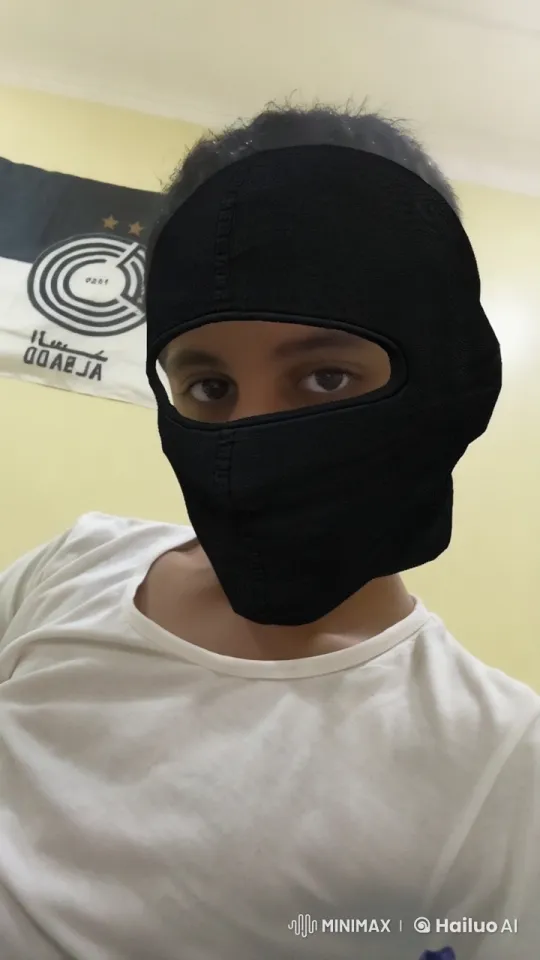 Young Man Smoking in Al-Sadd Sports Club-Themed Room – AI Generated Video | Hailuo AI