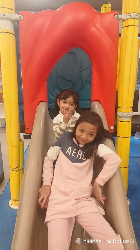 Children Playfully Fighting on Indoor Slide – AI Generated Video | Hailuo AI