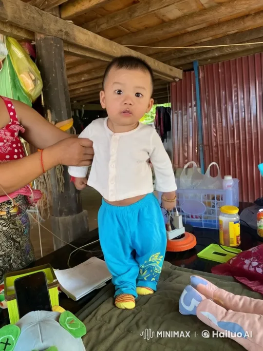 Child Practicing Kungfu with Support in Rustic Setting – AI Generated Video | Hailuo AI