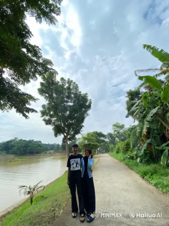 Couple Embraces by Serene Riverside Pathway – AI Generated Video | Hailuo AI