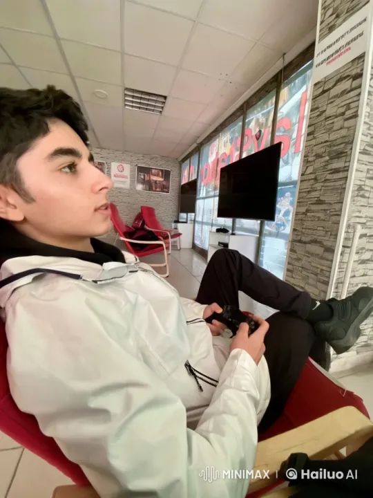 Person Transforms into Meerkat Playing Game in Cozy Lounge – AI Generated Video | Hailuo AI