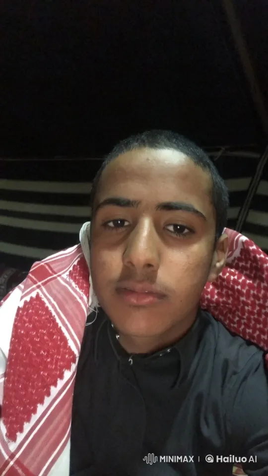 Person Smoking with Keffiyeh in Dimly Lit Setting – AI Generated Video | Hailuo AI