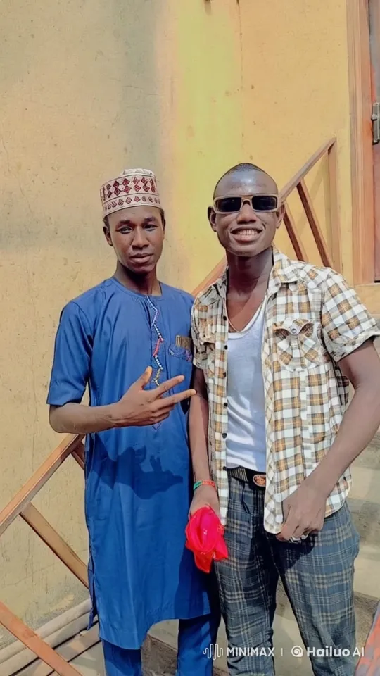 Outdoor Portrait of Two Men in Casual and Traditional Attire – AI Generated Video | Hailuo AI