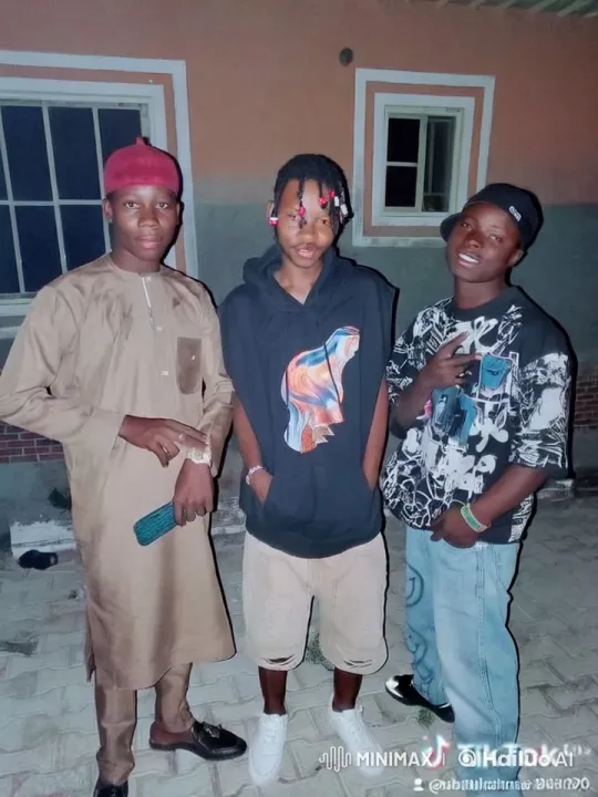 Young Men Pose in Front of House with Distinctive Colors – AI Generated Video | Hailuo AI