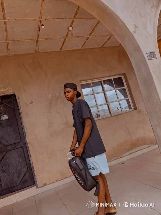 Young Man with Lacrosse Bag at Building Entrance – AI Generated Video | Hailuo AI
