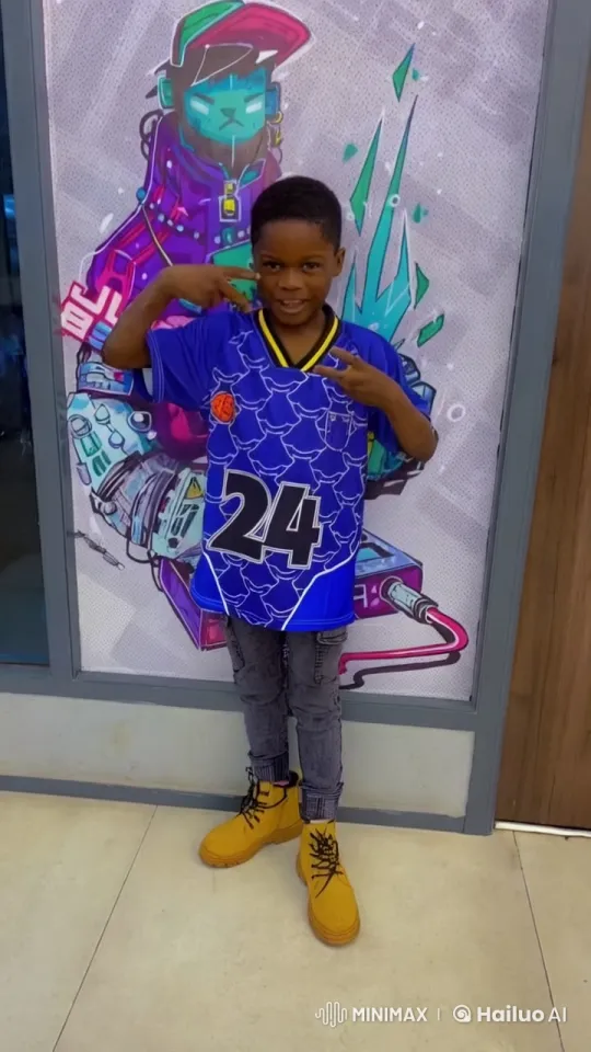 Boy Performs Kungfu in Front of Futuristic Mural – AI Generated Video | Hailuo AI
