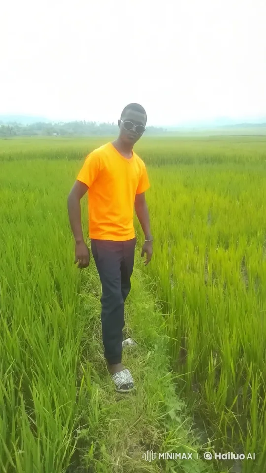 Man Prepares for Combat in Serene Green Field – AI Generated Video | Hailuo AI