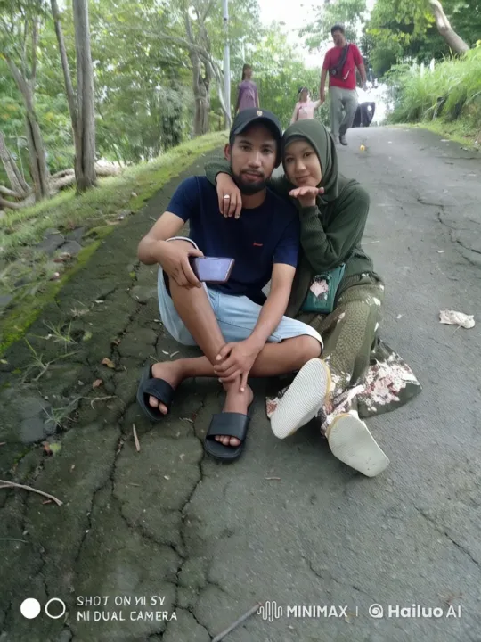 Couple Relaxing on Path with Scenic Outdoor Background – AI Generated Video | Hailuo AI