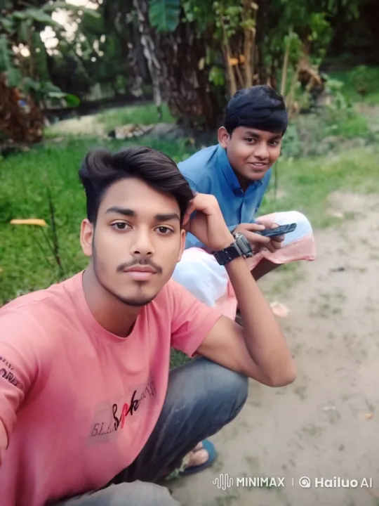 Two Young Men Engage in Playful Mock Fight in Lush Setting – AI Generated Video | Hailuo AI