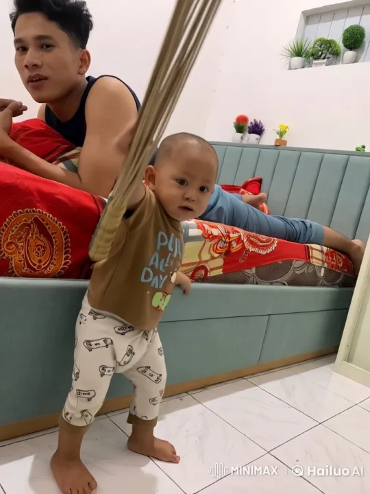 Child Practicing Kungfu with Joy in Cozy Room – AI Generated Video | Hailuo AI