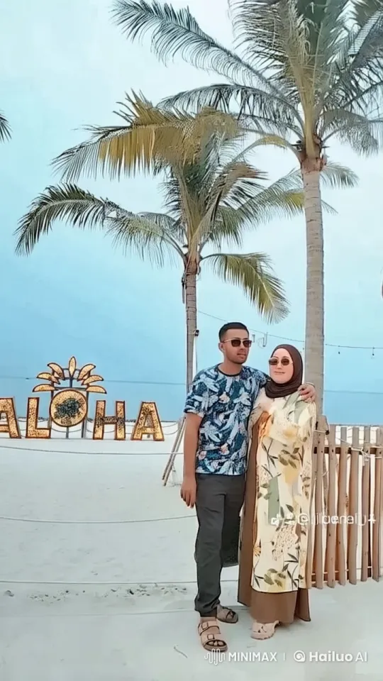 Couple Relaxing on Tropical Beach with Aloha Greeting – AI Generated Video | Hailuo AI