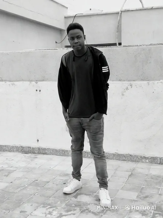 Casual Person Leaning on Rooftop in Monochrome Daylight – AI Generated Video | Hailuo AI