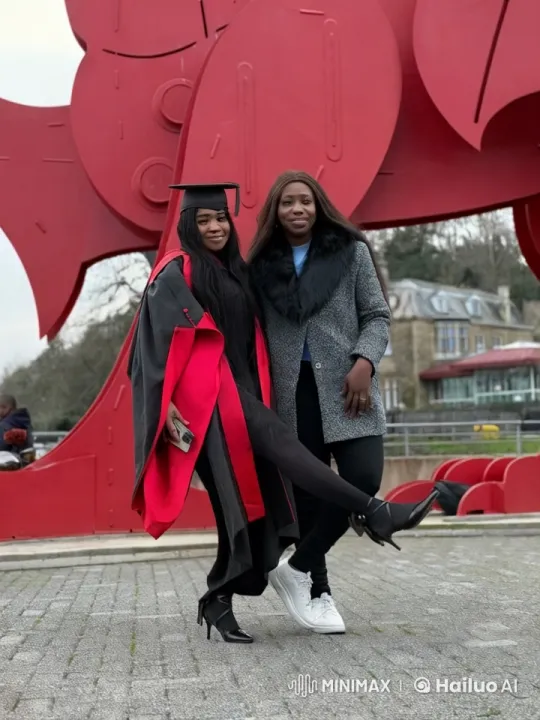 Graduate Celebrates with Kickboxing in Front of Sculpture – AI Generated Video | Hailuo AI