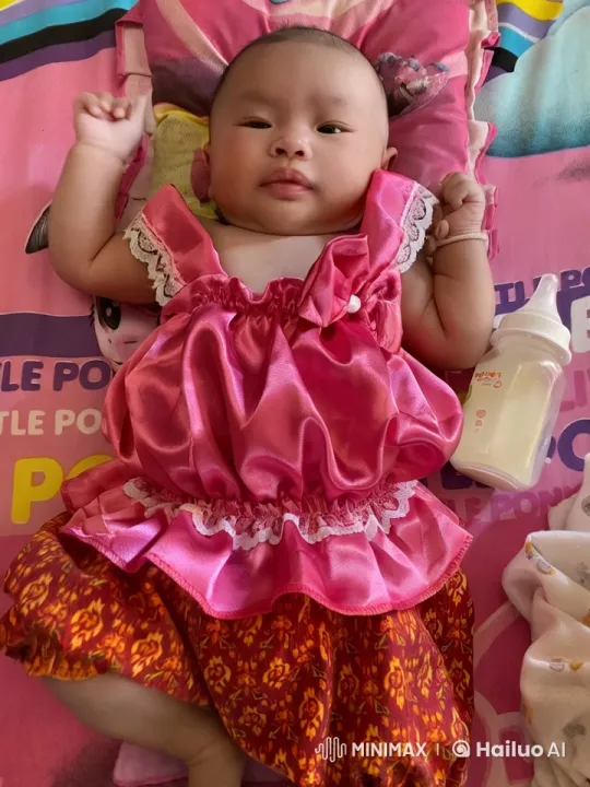 Baby Mimics Playful Fighting on Cartoon-Decorated Bed – AI Generated Video | Hailuo AI