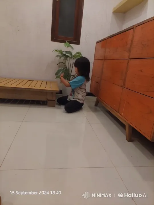 Young Girl Tends to Plant with Serene Care – AI Generated Video | Hailuo AI