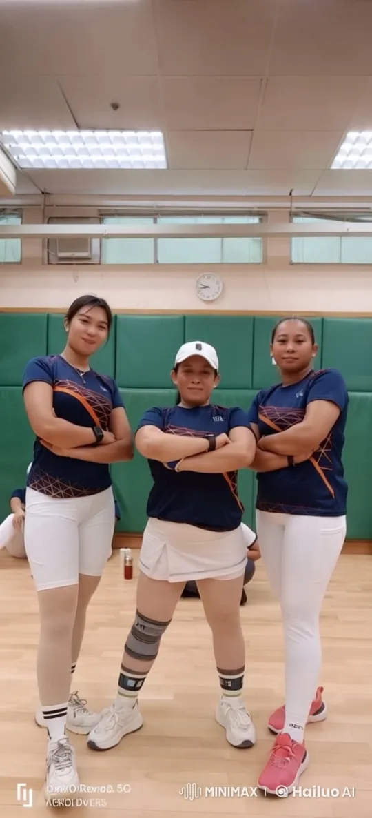 Athletic Trio in Coordinated Outfits in Gym Setting – AI Generated Video | Hailuo AI