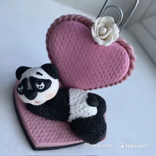 Adorable Panda Figurine Relaxing on Decorated Cushion – AI Generated Video | Hailuo AI