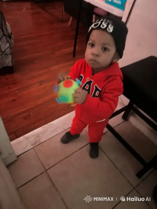 Child Mimics Kung Fu with Ball in Cozy Room – AI Generated Video | Hailuo AI
