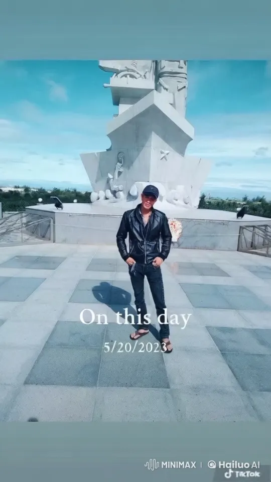 Confident Person Stands by Statue on Serene Day – AI Generated Video | Hailuo AI
