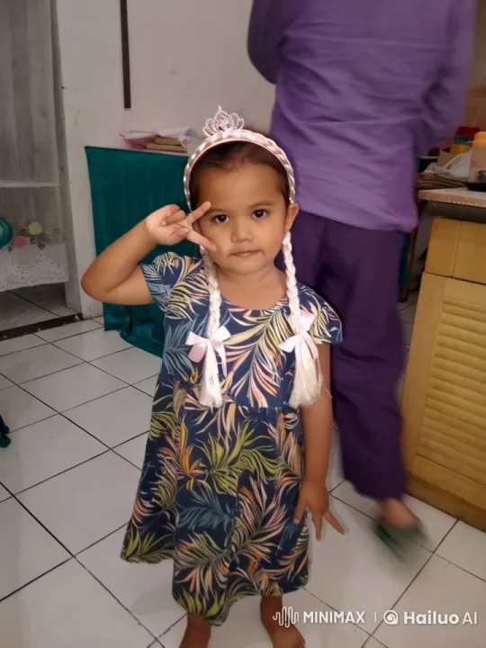Child in Kitchen Making Gestures, Adult in Background – AI Generated Video | Hailuo AI