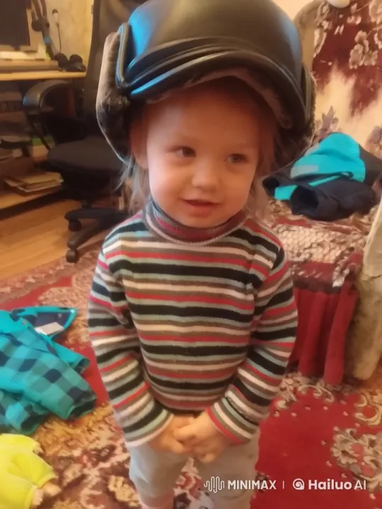 Child Swings in Helmet, Room of Clutter Captured – AI Generated Video | Hailuo AI