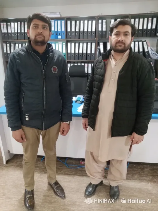 Office Fight: Two Men in Winter Clothing Engage in Physical Confrontation – AI Generated Video | Hailuo AI