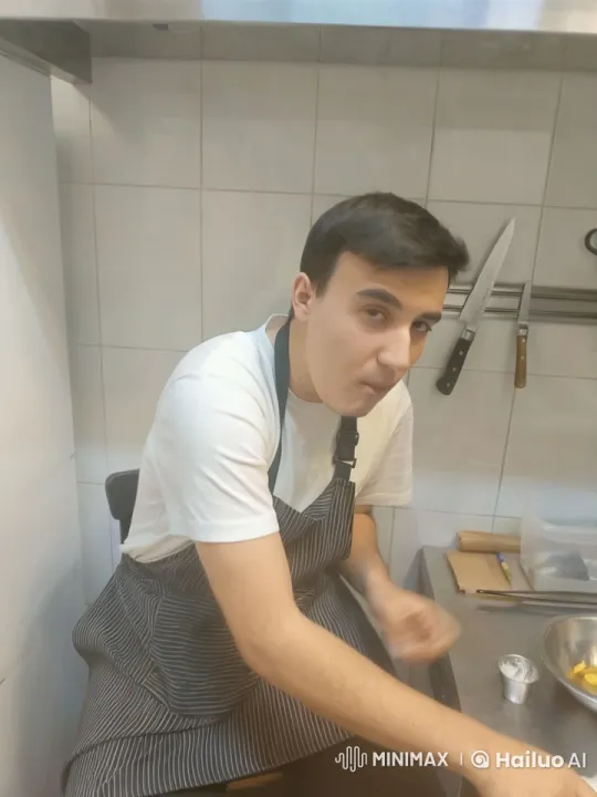 Young Chef Preparing Meal in Neat Kitchen – AI Generated Video | Hailuo AI