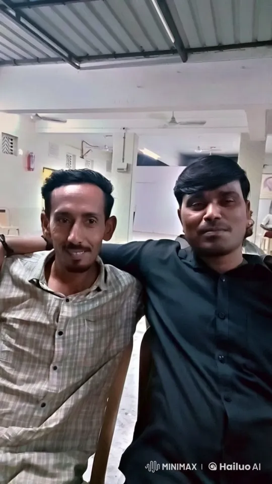 Two Men Share Affectionate Moment in Open-Plan Room – AI Generated Video | Hailuo AI