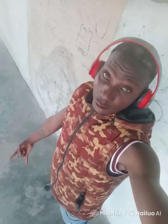 Person Waves in Red Camouflage Vest Against Graffiti – AI Generated Video | Hailuo AI