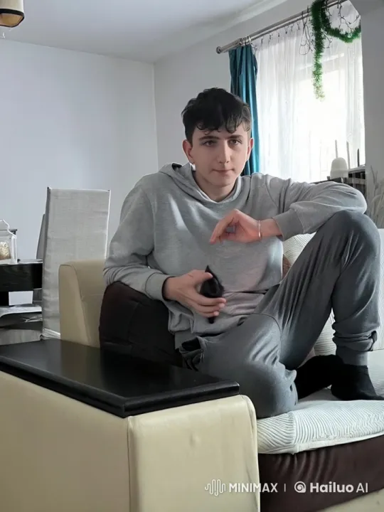 Young Man Relaxing with Pipe in Cozy Living Room – AI Generated Video | Hailuo AI