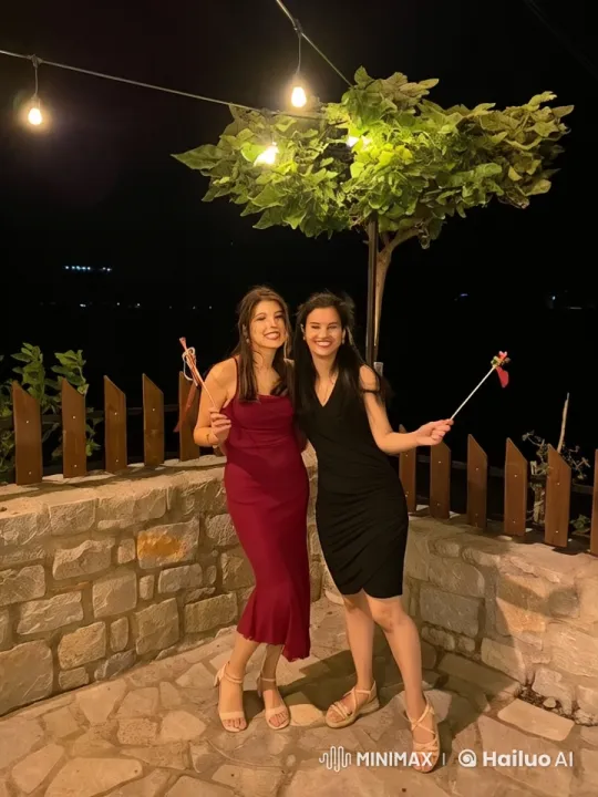 Girls in Elegant Dresses Share a Friendly Kiss – AI Generated Video | Hailuo AI
