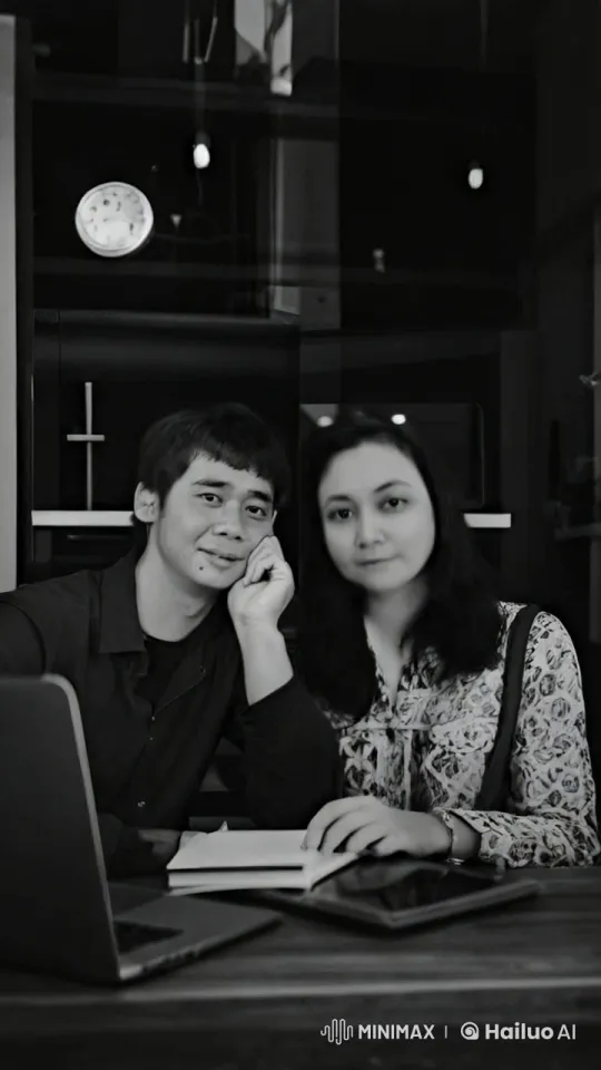 Couple Discussing Over Drinks in Modern Library Setting – AI Generated Video | Hailuo AI