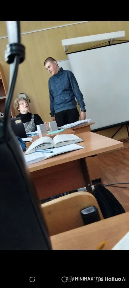 Middle-aged Couple Shares Kiss in Classroom Setting – AI Generated Video | Hailuo AI