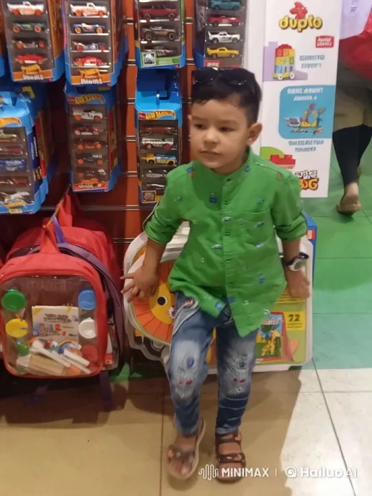 Boy in Toy Store Examining Items with Curiosity – AI Generated Video | Hailuo AI