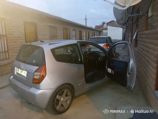 Distant Explosion Engulfs Parked Citroën C2 Scene – AI Generated Video | Hailuo AI