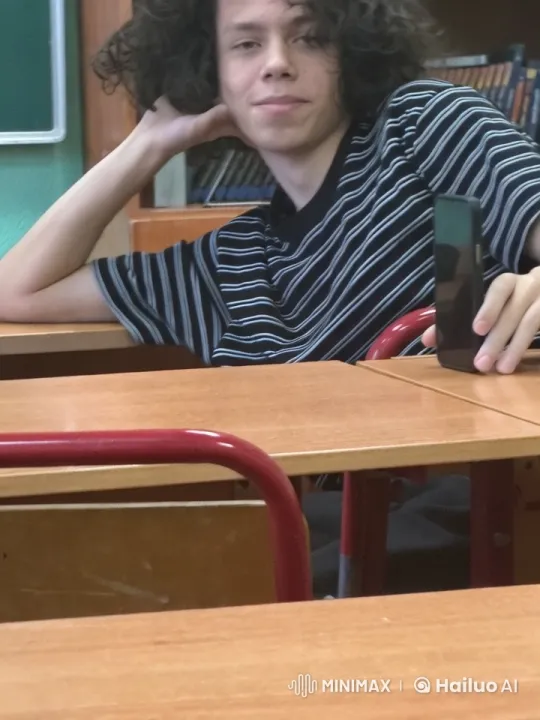 Student Reflects with Smartphone in Animated Classroom – AI Generated Video | Hailuo AI