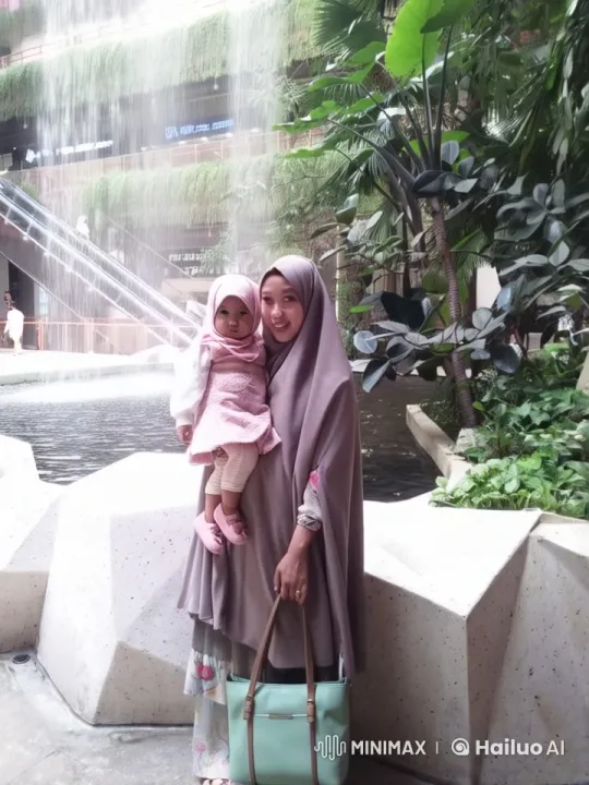 Peaceful Garden: Hijab-Wearing Woman and Child Practice Kungfu – AI Generated Video | Hailuo AI