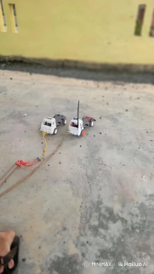Animated White Trucks Pull Sticks on Yellow Wall Background – AI Generated Video | Hailuo AI