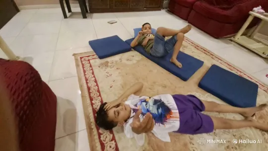 Two Boys Relaxing in a Cozy Living Room – AI Generated Video | Hailuo AI