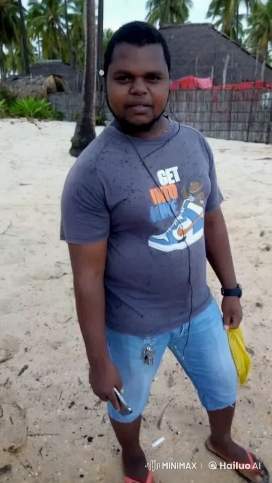 Casual Beachgoer Enjoying Music on Tropical Beach – AI Generated Video | Hailuo AI
