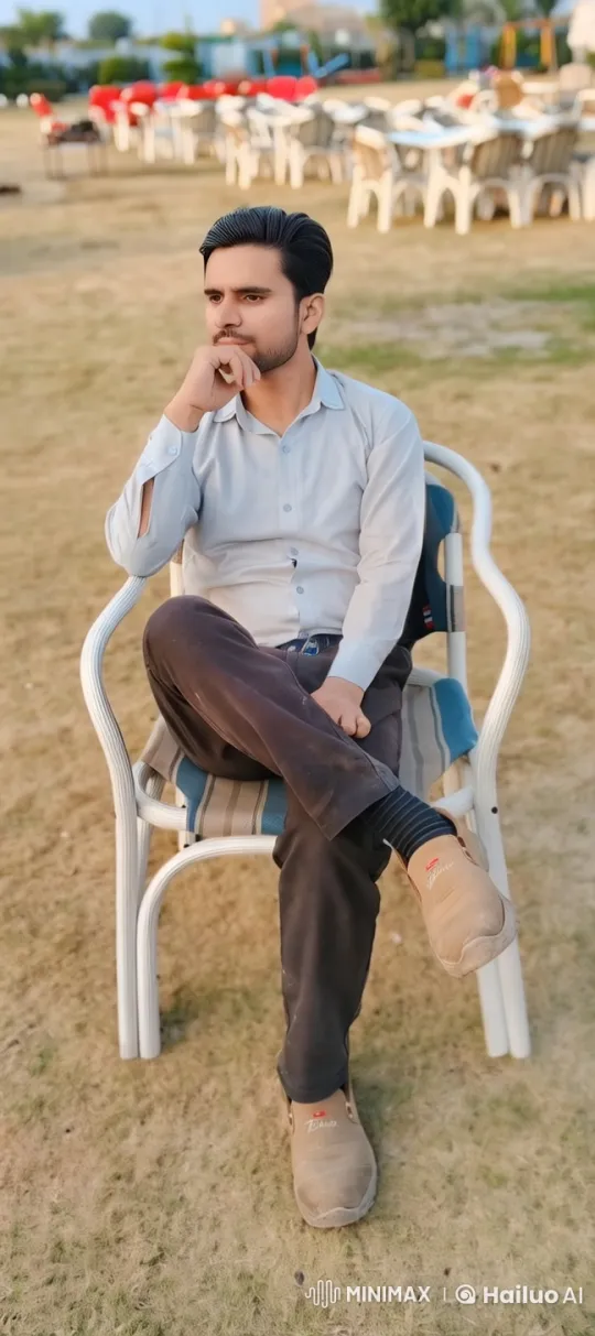 Contemplative Man in Lively Outdoor Setting – AI Generated Video | Hailuo AI