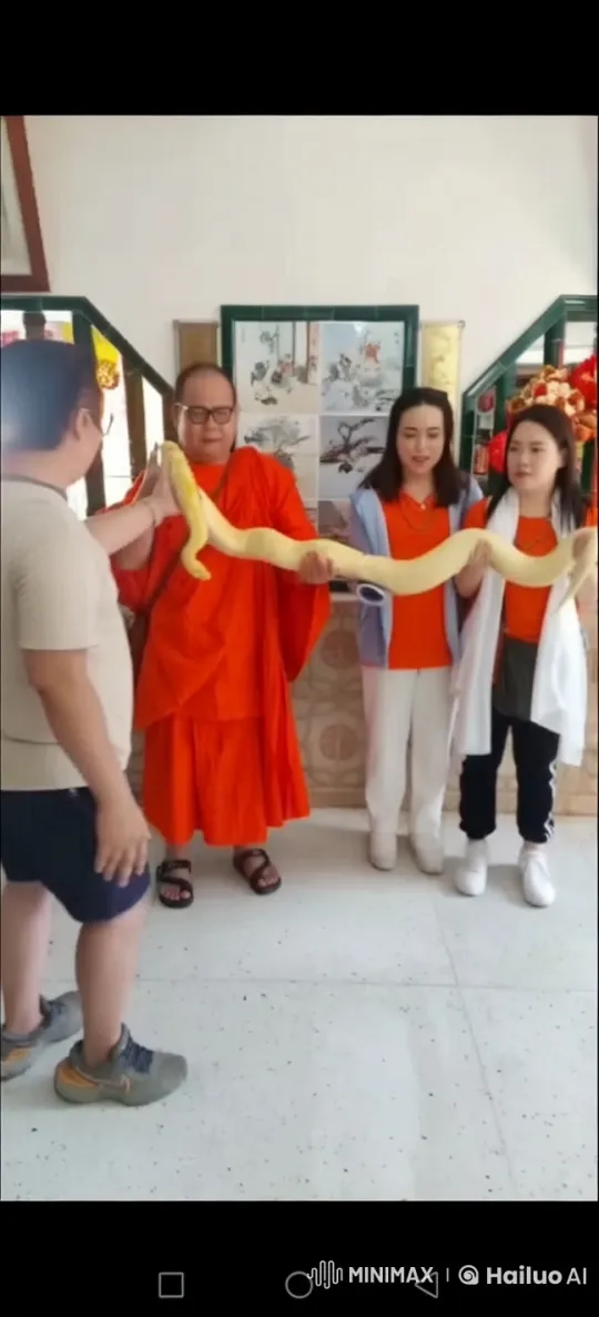 Group Holds Yellow Snake in Brightly Lit Room – AI Generated Video | Hailuo AI