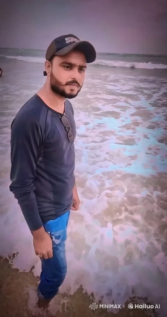 Man Stands in Shallow Water at Overcast Beach – AI Generated Video | Hailuo AI
