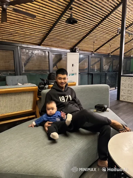 Casual Setting: Man Performs Kungfu with Baby Watching – AI Generated Video | Hailuo AI