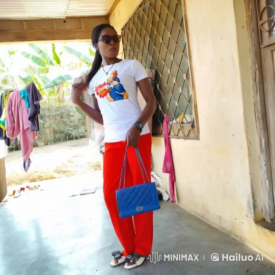 Woman in Graphic Tee Stands by House in Animated Video – AI Generated Video | Hailuo AI