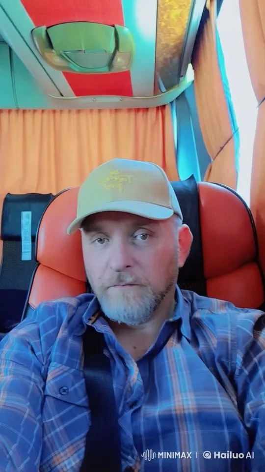 Relaxed Bodybuilder on a Vibrant Bus Journey – AI Generated Video | Hailuo AI