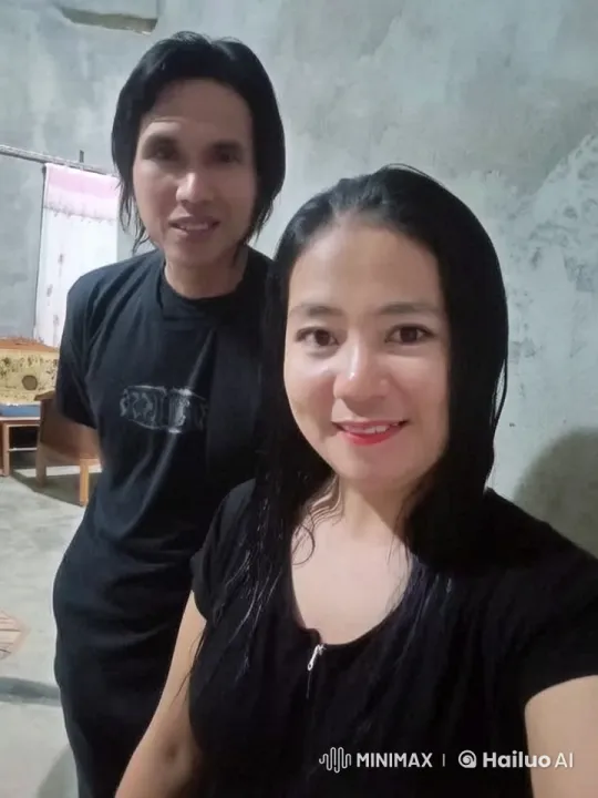 Couple Capturing a Moment in a Cozy Room – AI Generated Video | Hailuo AI